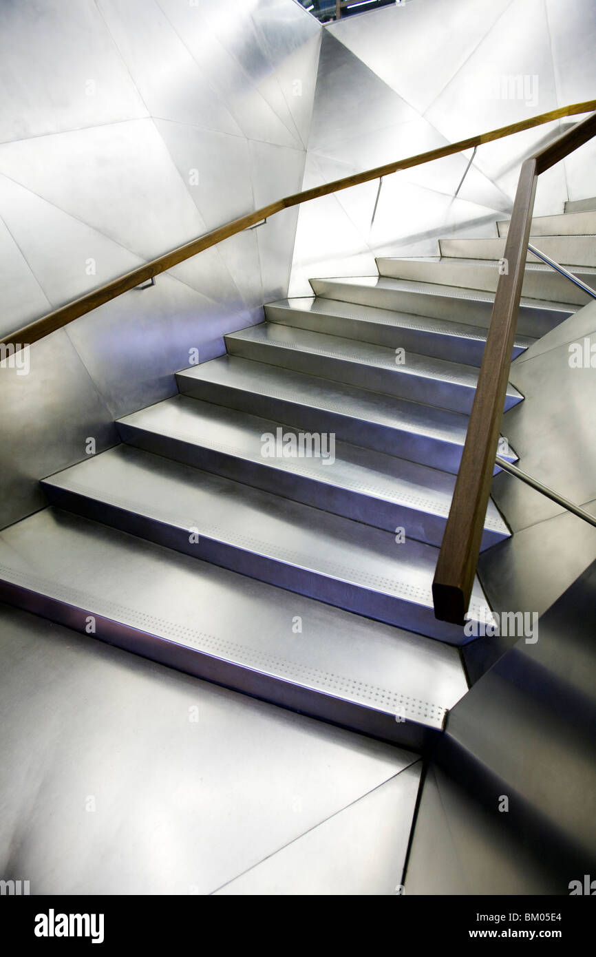 Stainless steel staircase in the entrace to Caixa Forum building, Madrid, Spain, work by Jacques Herzog and Pierre de Meuron. Stock Photo