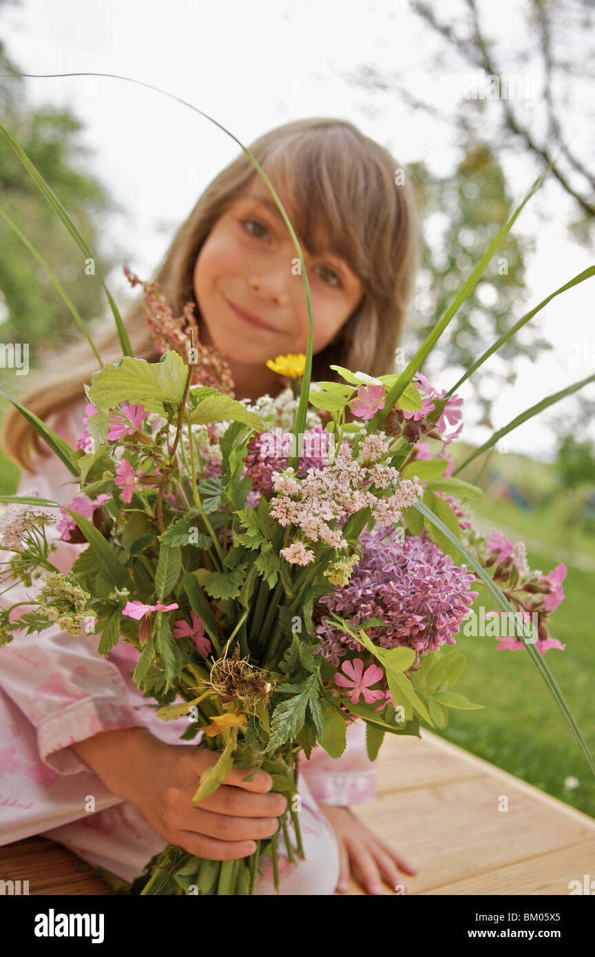 Little girl with a bouquet of flowers Stock Photo - Alamy