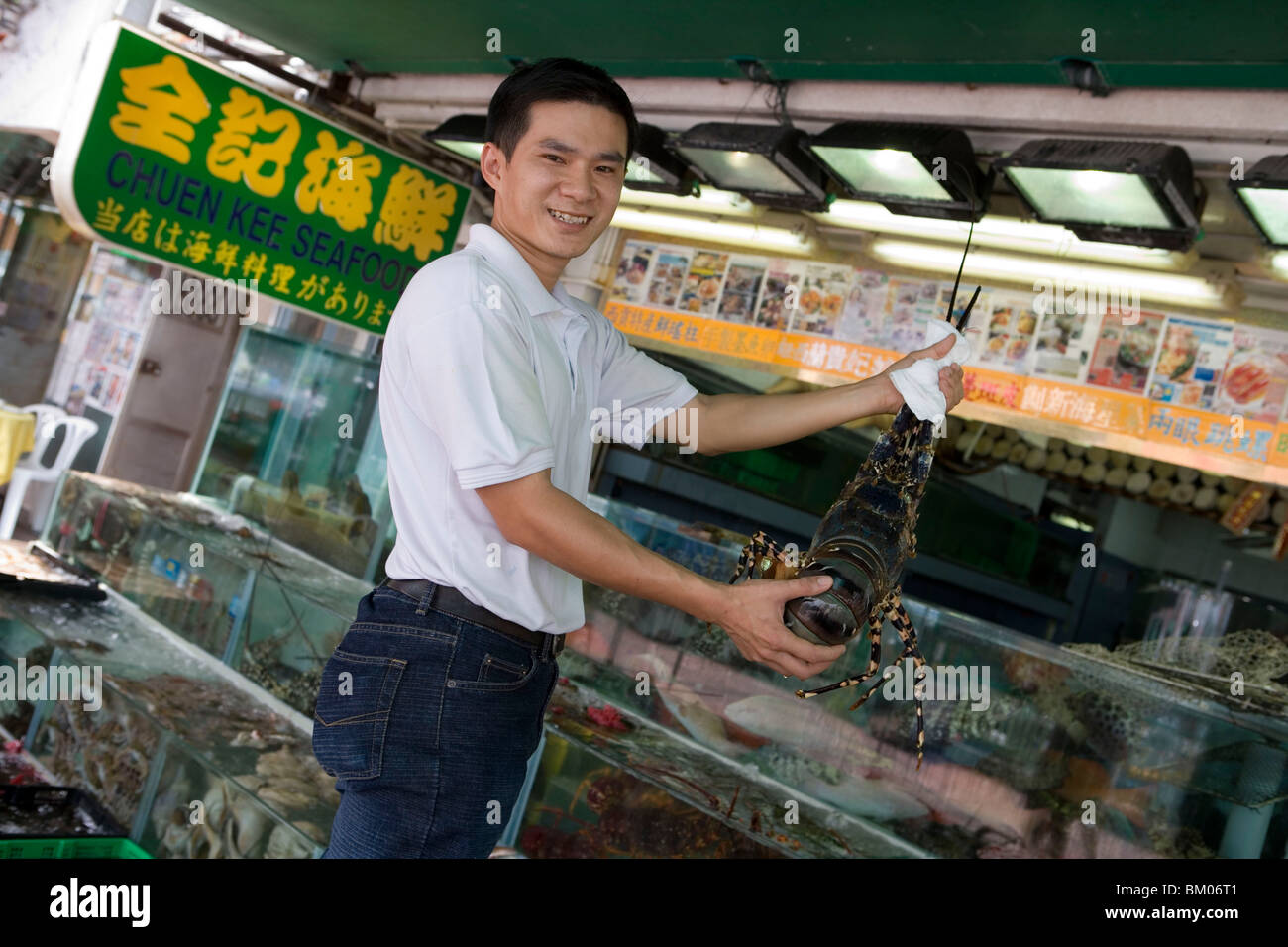 Man with Live Lobster, Chuen Kee Seafood Restaurant, Sai Kung, New Territories, Hong Kong Stock Photo