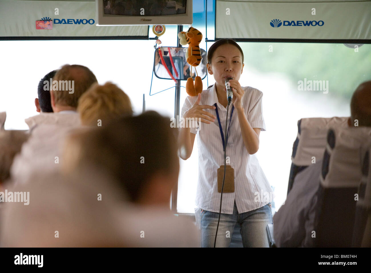Tour guide talking on bus hi-res stock photography and images - Alamy