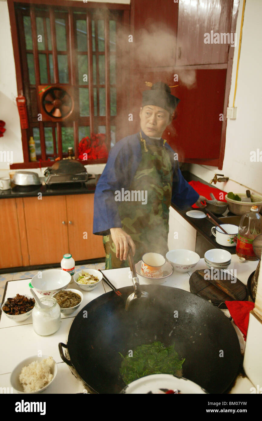 kitchen, cooking with wok, Huangting convent, nunnery, Heng Shan south, Hunan province, Hengshan, Mount Heng, China, Asia Stock Photo