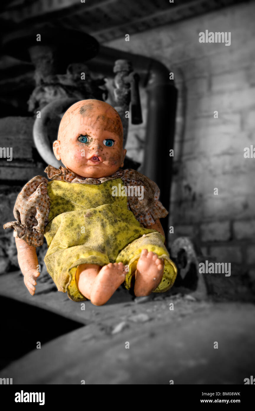 An old dirty plastic doll Stock Photo