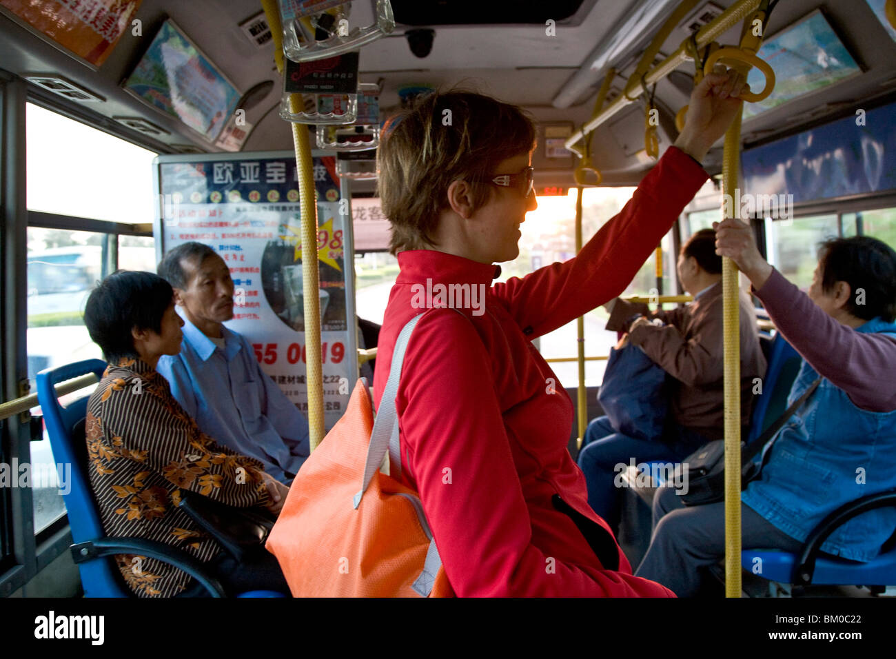 German tourist on a Chinese bus at sunset, Xiamen, Fujian province, China, Asia Stock Photo