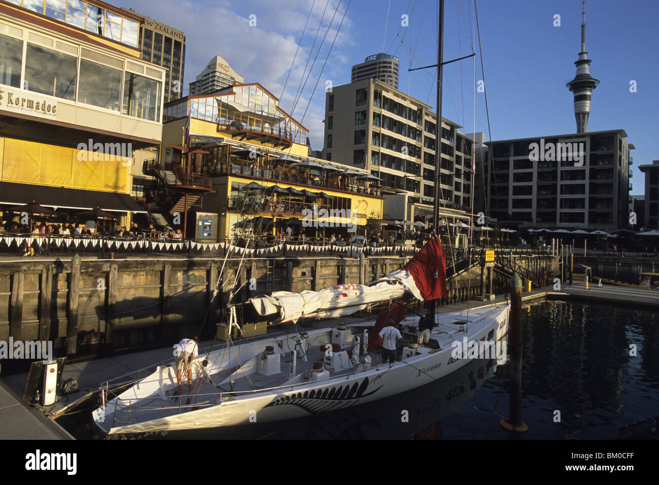 NZL-40 Yacht and Restaurants at Viaduct Basin, Auckland, North Island, New Zealand Stock Photo