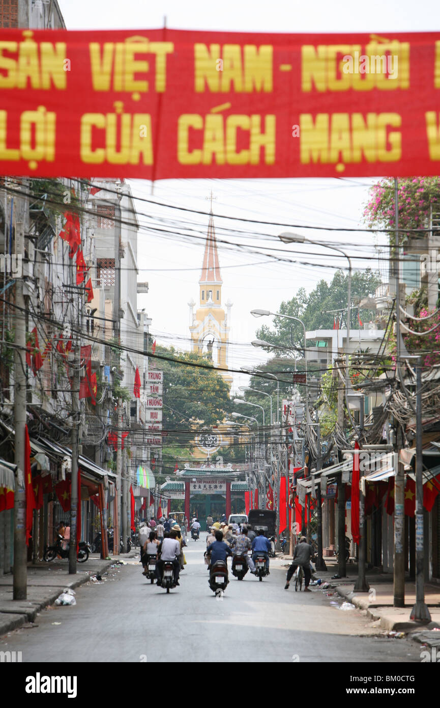 political banner and Vietnamese flags New Year festival, Tet, in a street, Cholon quarter