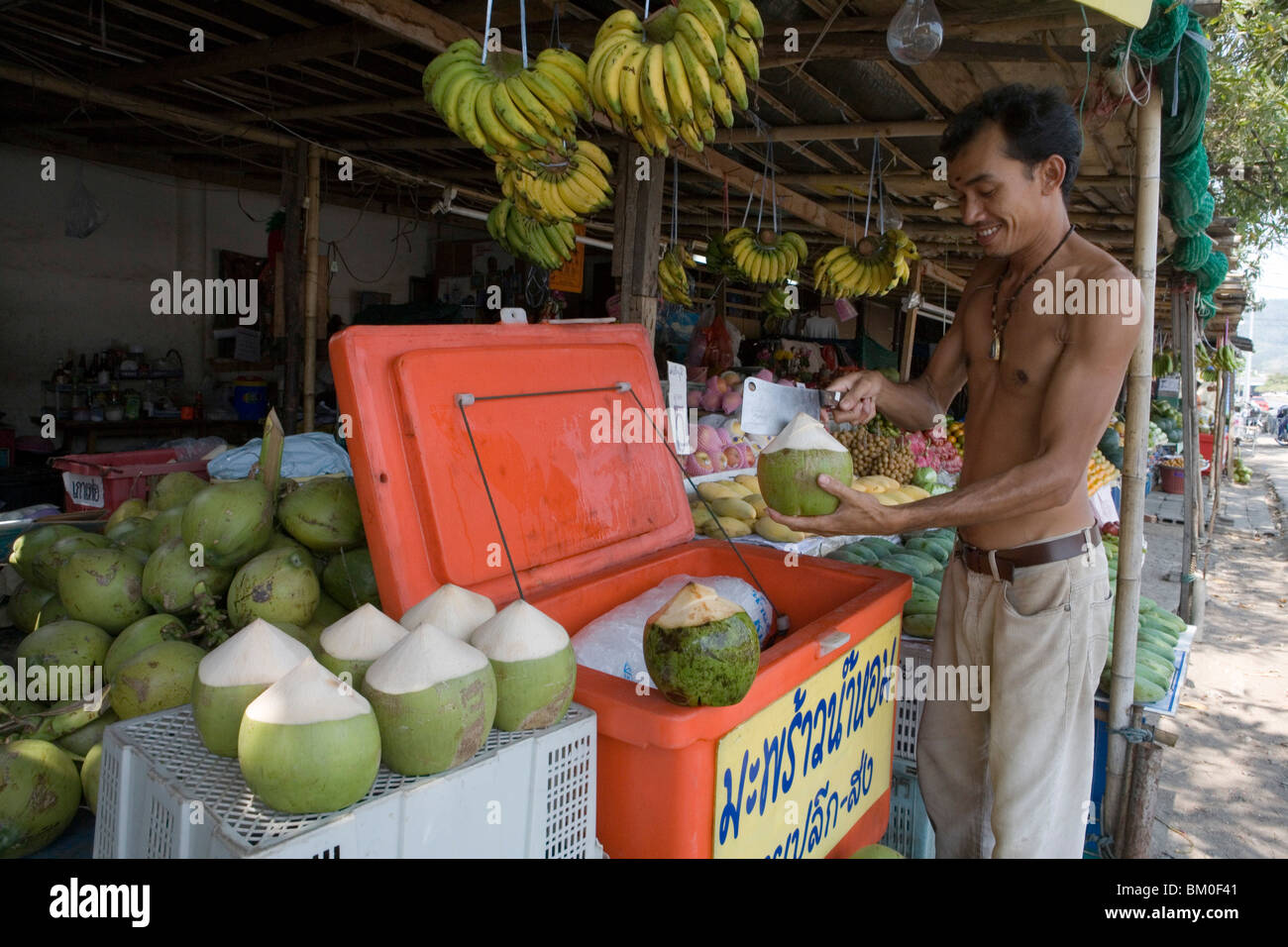 Opening Chilled Coconut, Phuket City, Phuket, Thailand Stock Photo