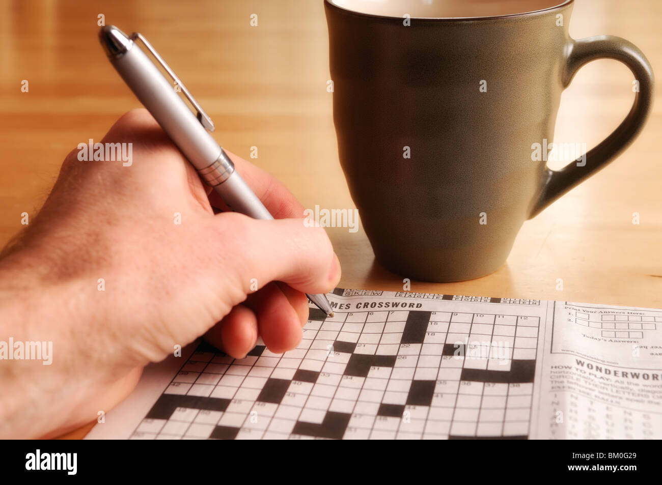 Crossword puzzle and morning coffee Stock Photo Alamy