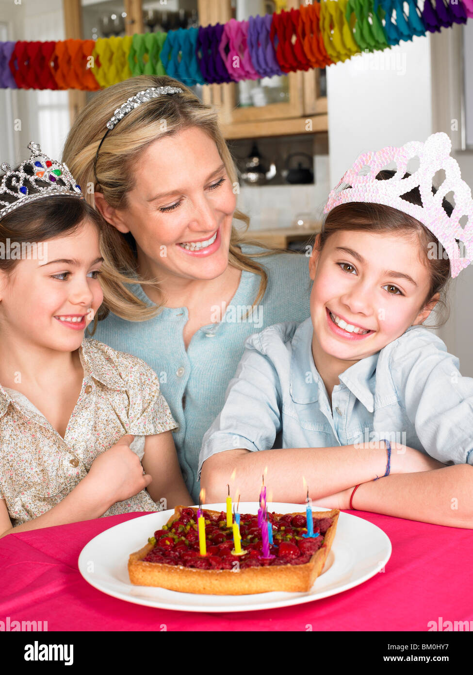 Mother and daughters celebrating Stock Photo