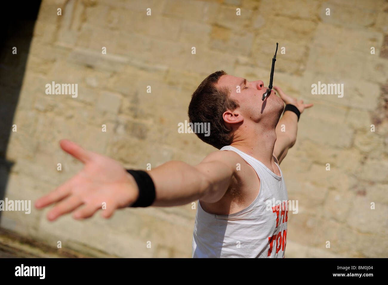a sword swallower swallowing a sword in Exeter, Devon Stock Photo Alamy