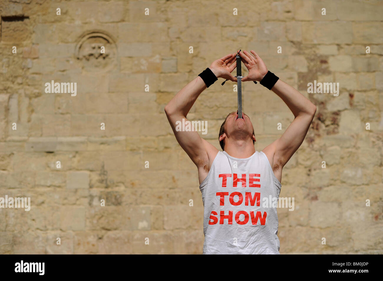 a sword swallower swallowing a sword in Exeter, Devon Stock Photo Alamy