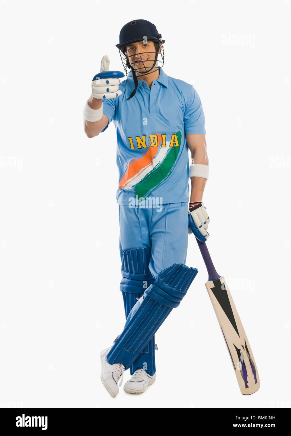 Cricket batsman standing at the non striker end and showing thumbs up