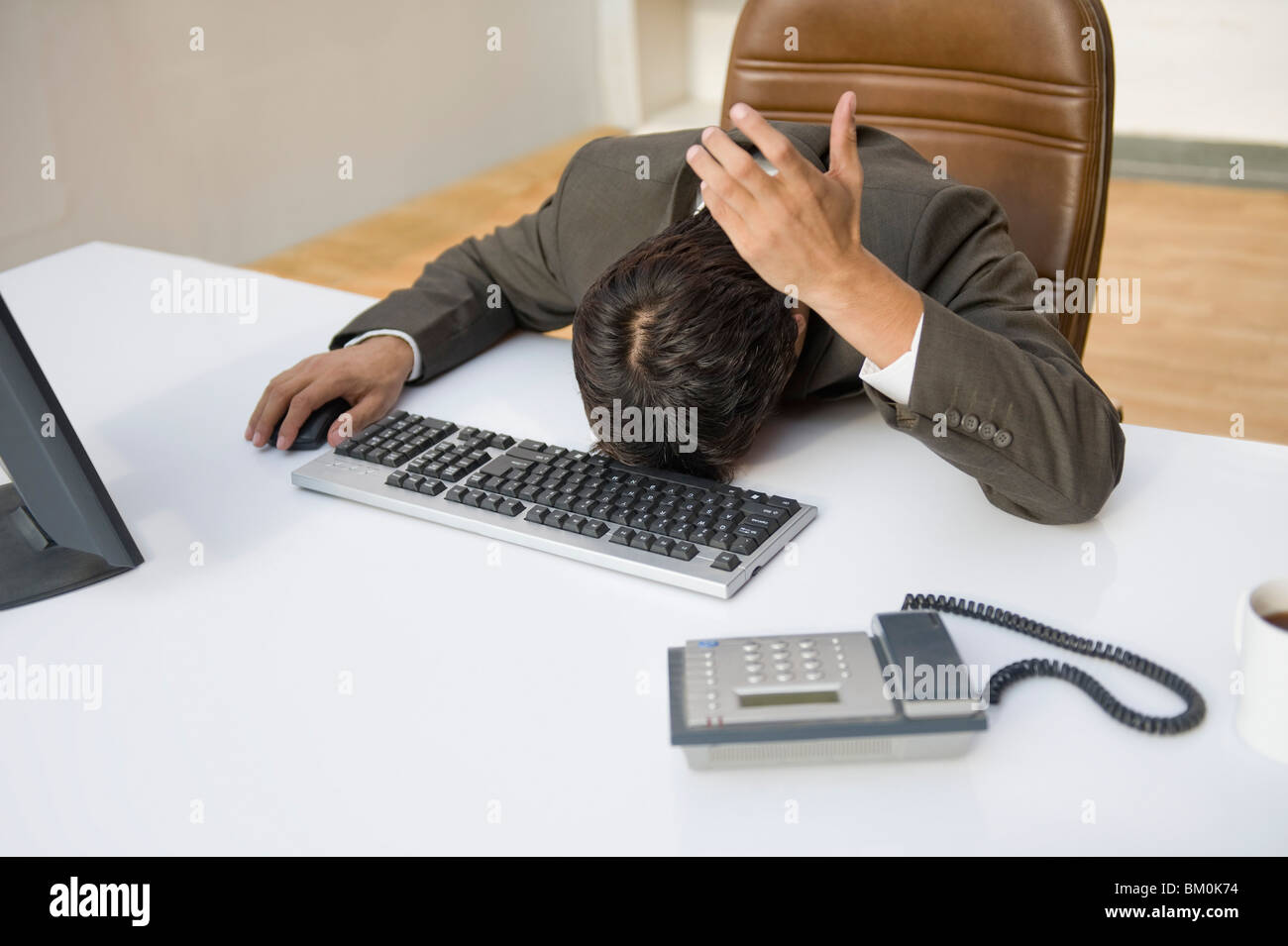 Businessman face down at an office desk Stock Photo 29518584 Alamy