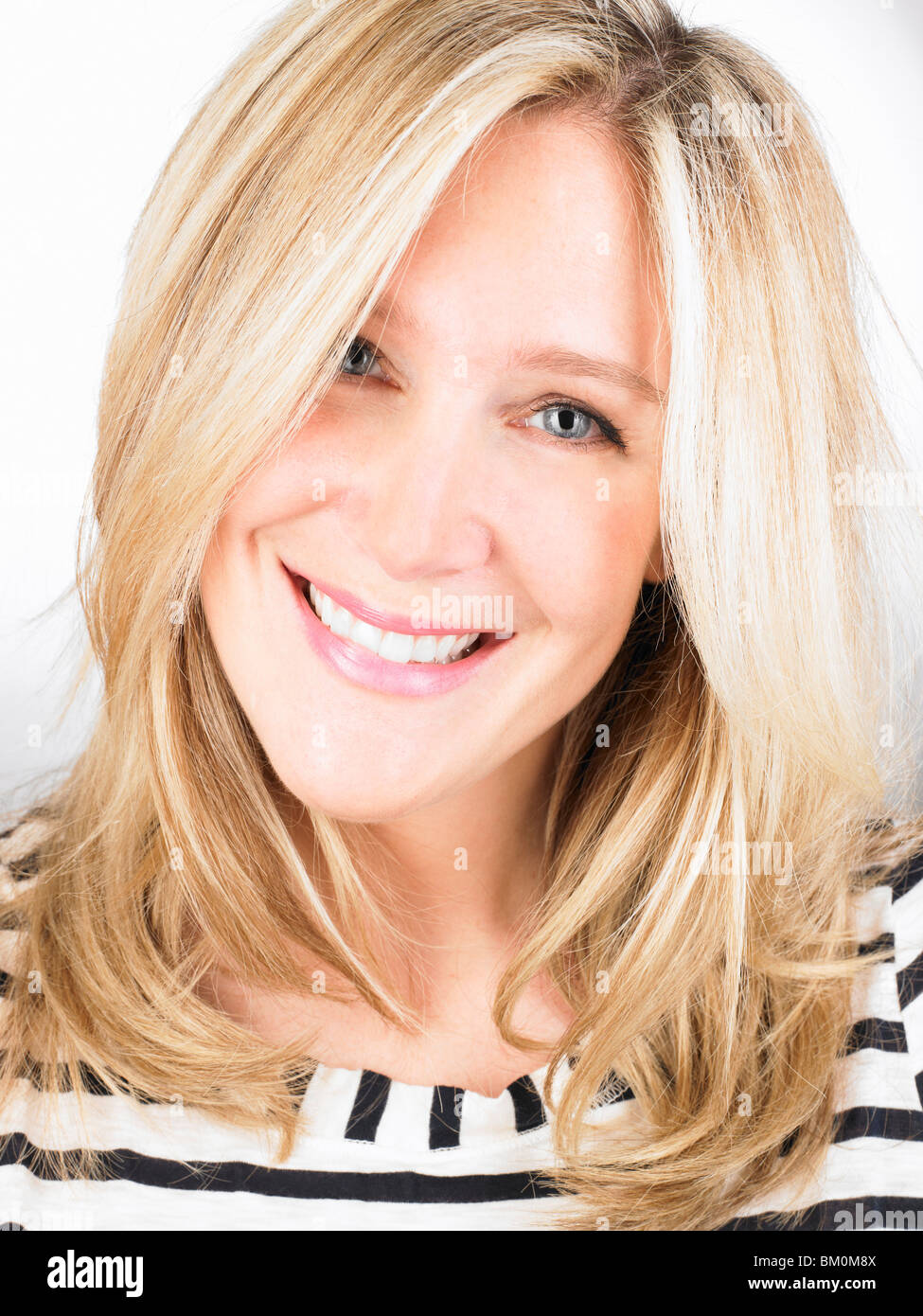 Pretty woman smiling at camera Stock Photo