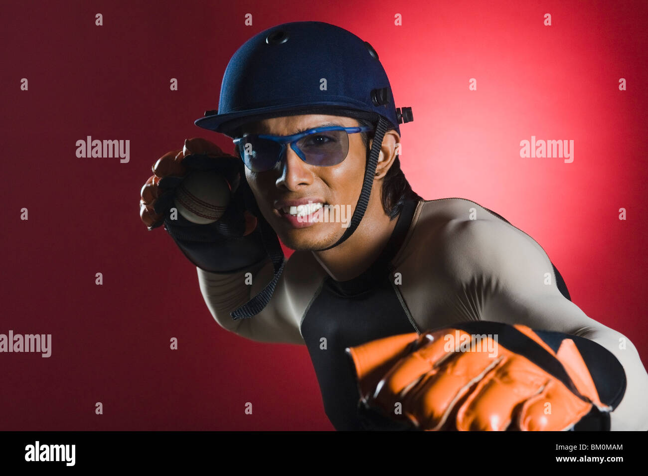 Wicket keeper throwing a cricket ball Stock Photo