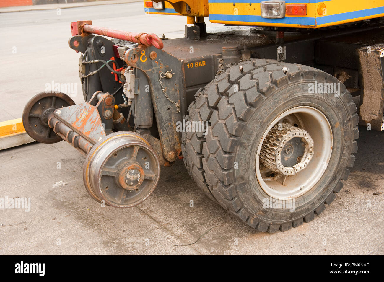 Road and Rail track wheels on track laying digger Stock Photo Alamy