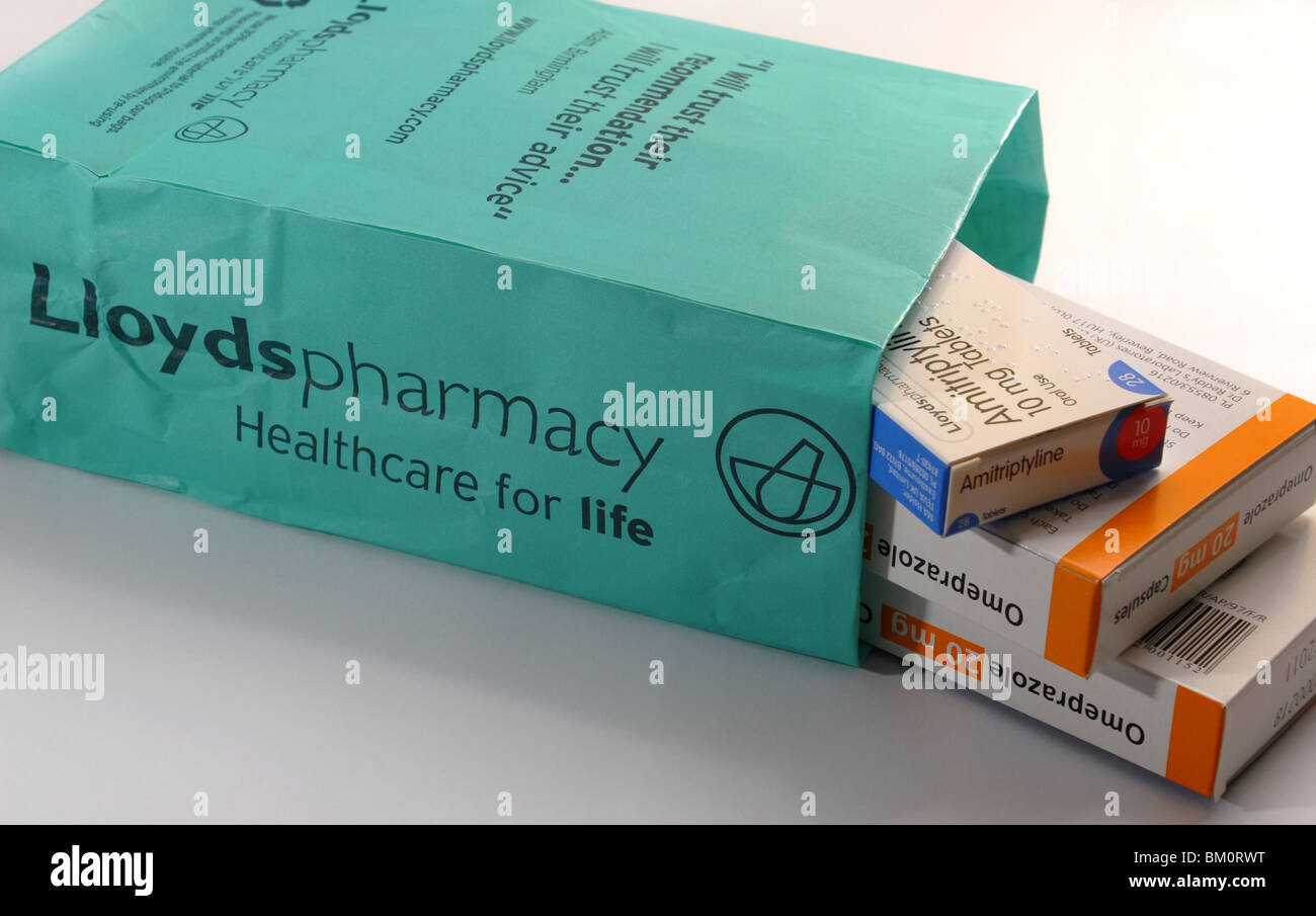 generic image of Lloyds Pharmacy bag and tablets, packets and labels Omeprazole anti acid Amitriptyline nerve pain depression Stock Photo