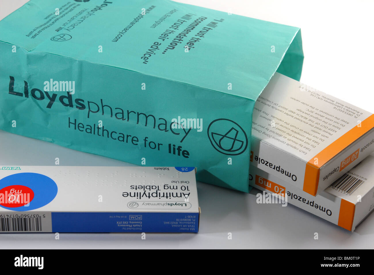 generic image of Lloyds Pharmacy bag and tablets, packets and labels  Omeprazole anti acid Amitriptyline nerve pain depression Stock Photo - Alamy