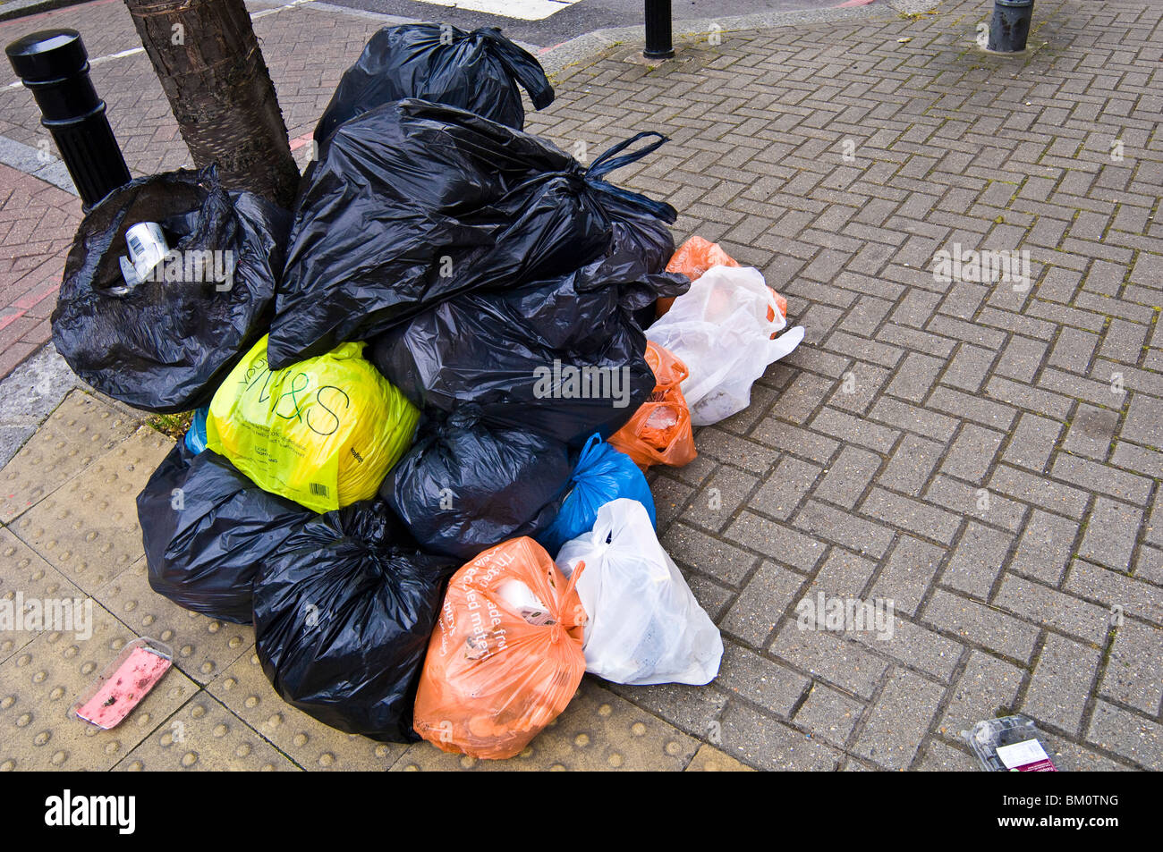 Pile of rubbish bags in residential area Stock Photo Alamy