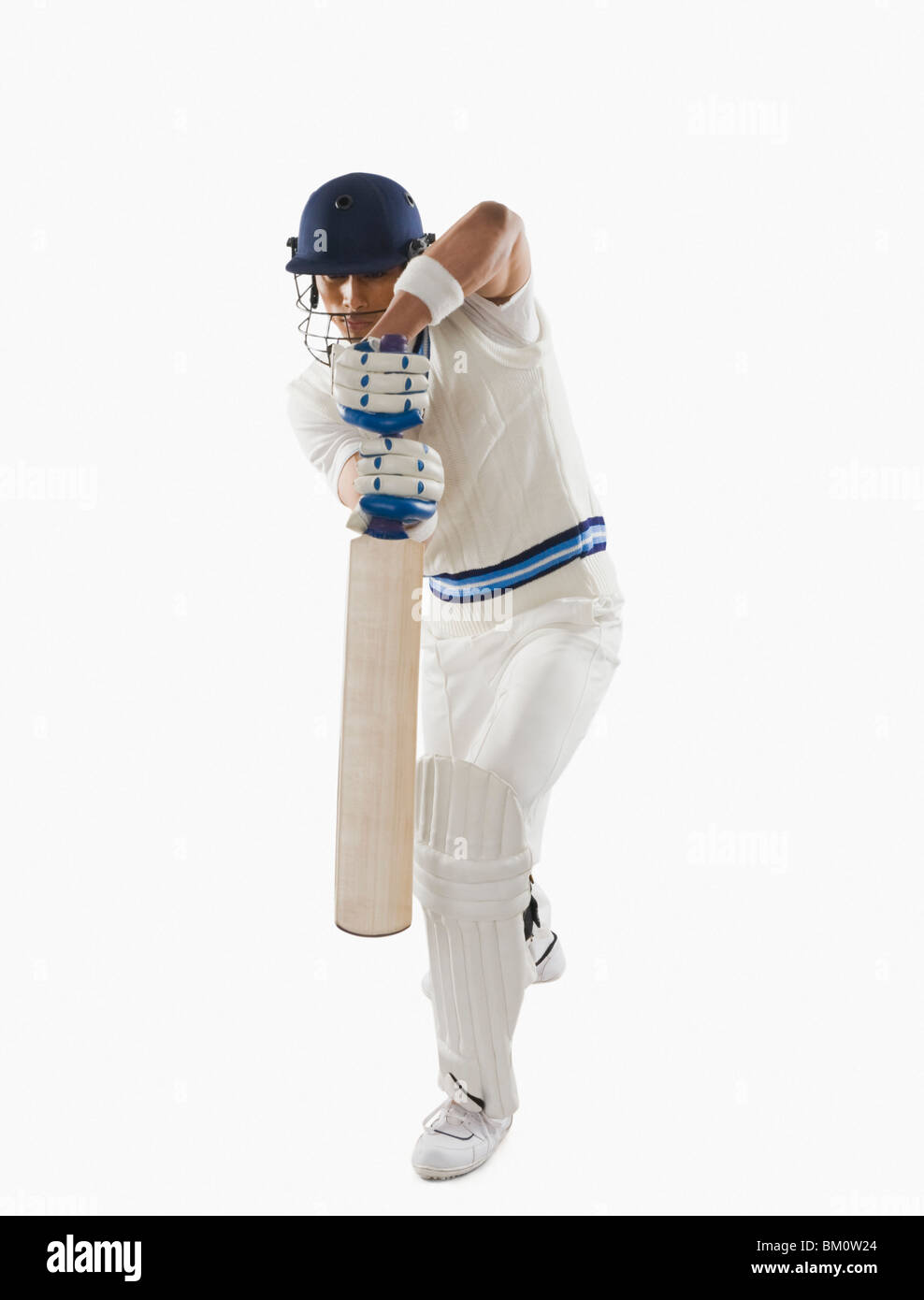 Cricket batsman playing forward defensive stroke Stock Photo Alamy