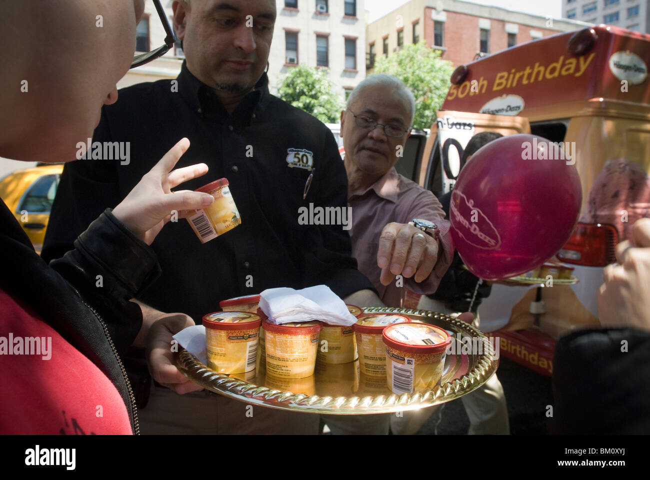 Employees distributing free samples of ice cream