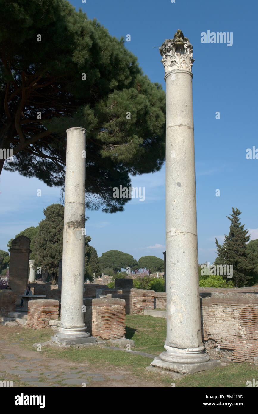 Ostia Antica, Rome. Two columns along the Decumanus Maximus decorating the entrance to the Macellum (Market). Stock Photo