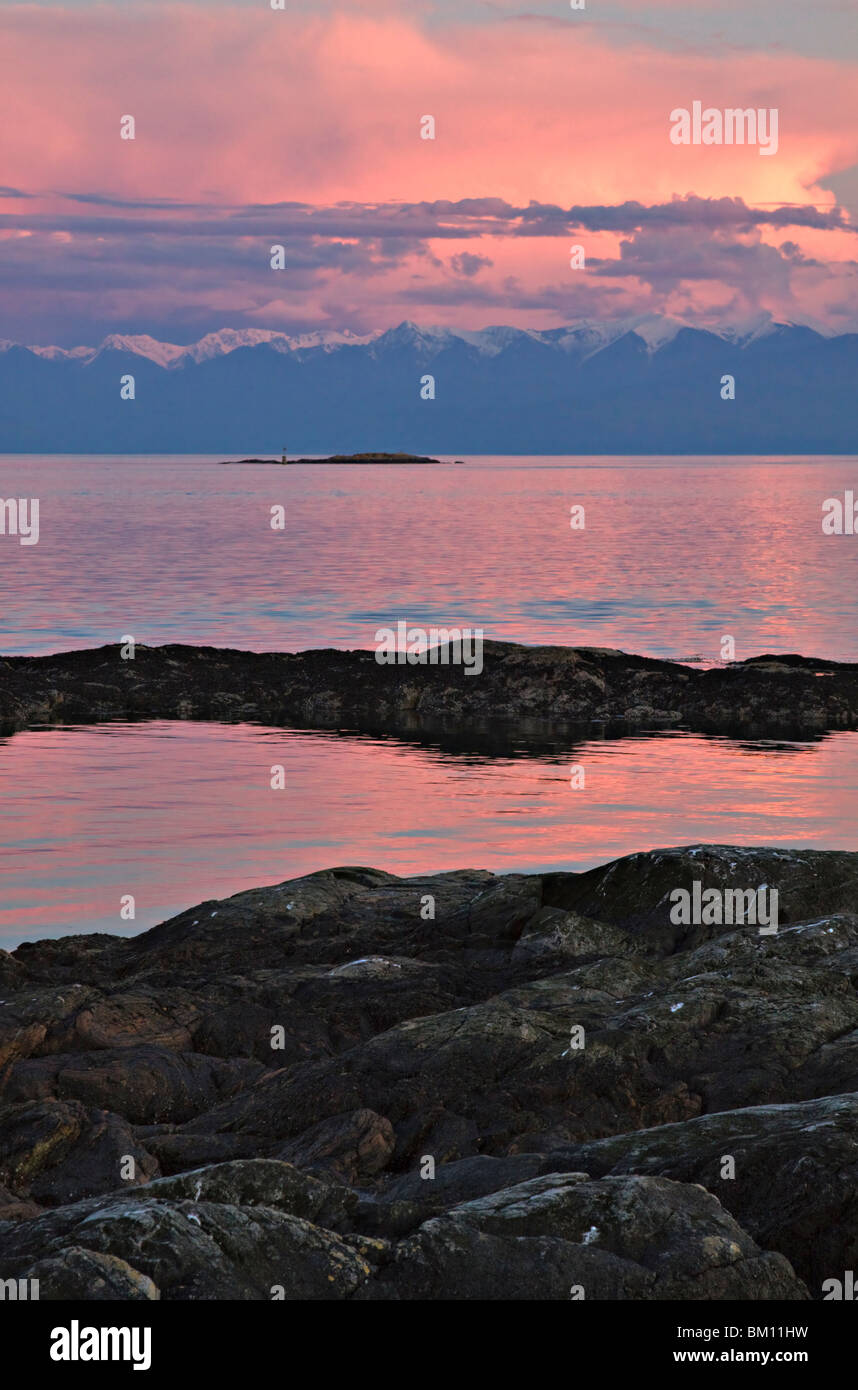 Olympic Mountains from Cattle Point, Victoria, across the Strait of Juan de Fuca at sunset Stock Photo