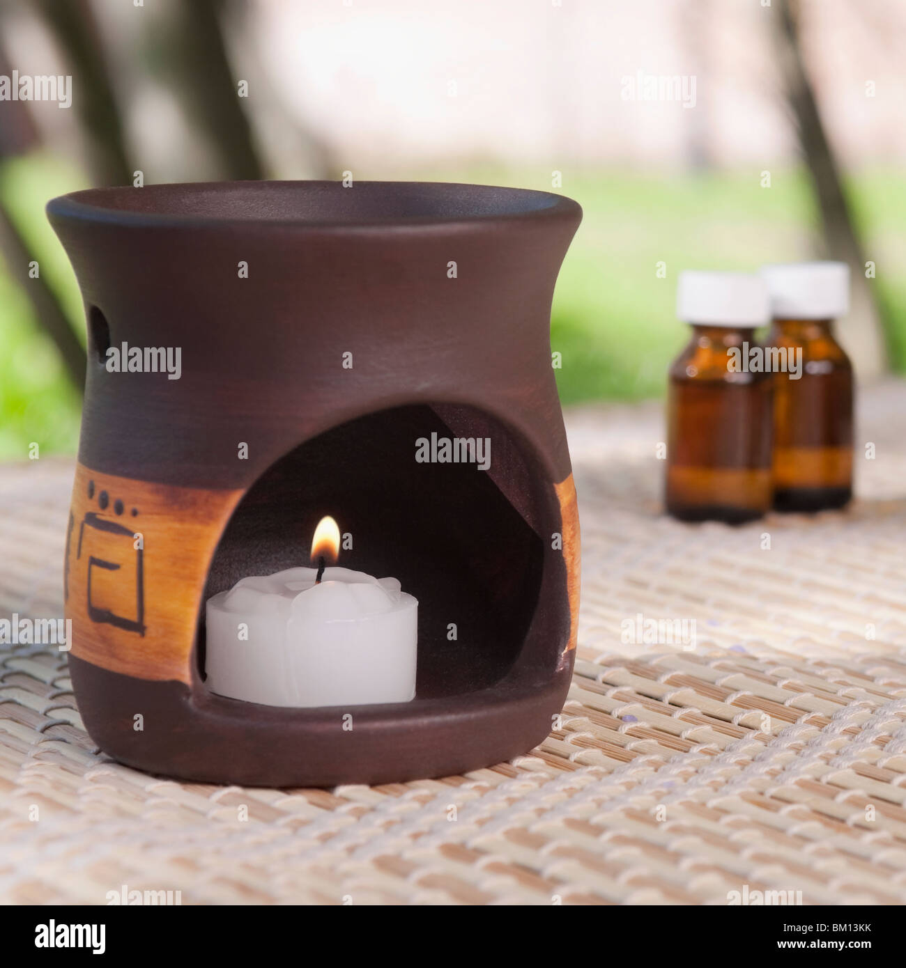 Aromatherapy burner with aromatherapy oil bottles Stock Photo Alamy