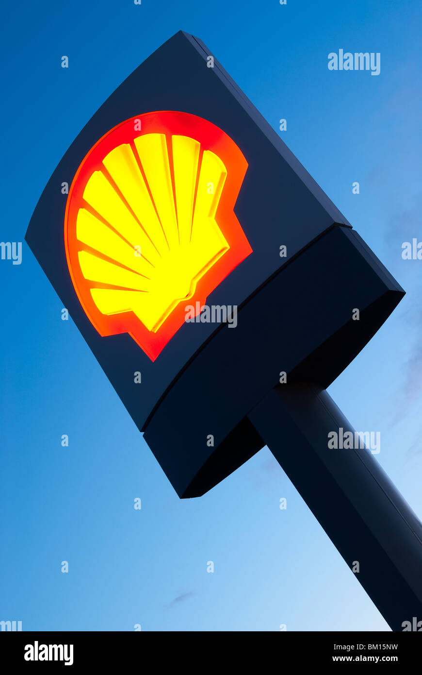 Illuminated Shell Oil sign at civil twilight Stock Photo