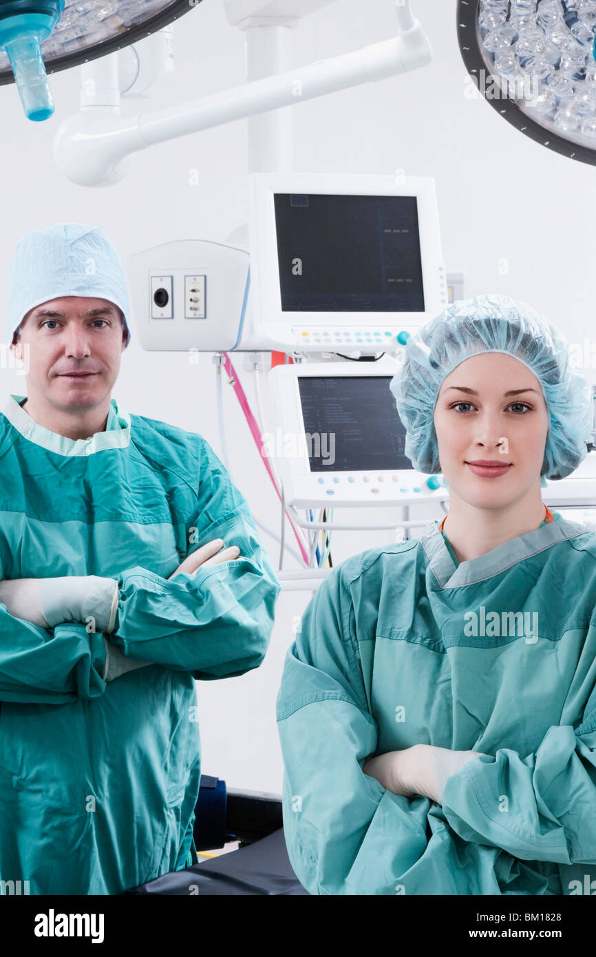 Surgeons smiling in an operating room Stock Photo - Alamy