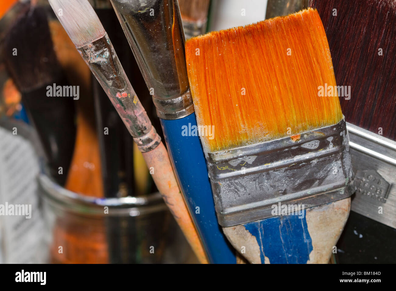 Artists paintbrush. Paintbrushes in various sizes in an artists studio Stock Photo