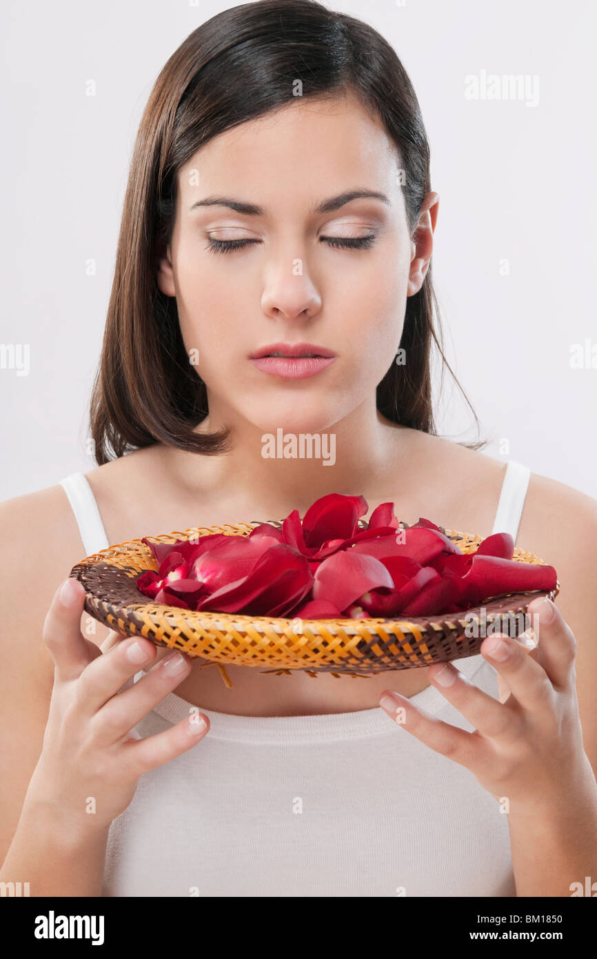 Woman smelling rose petals Stock Photo Alamy