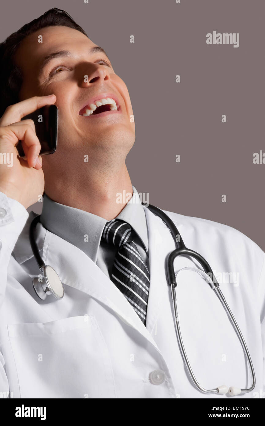 Laughing hispanic male doctor hi-res stock photography and images - Alamy