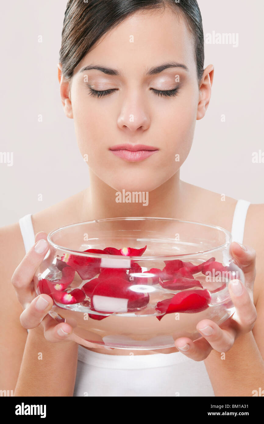 Woman smelling rose petals Stock Photo Alamy