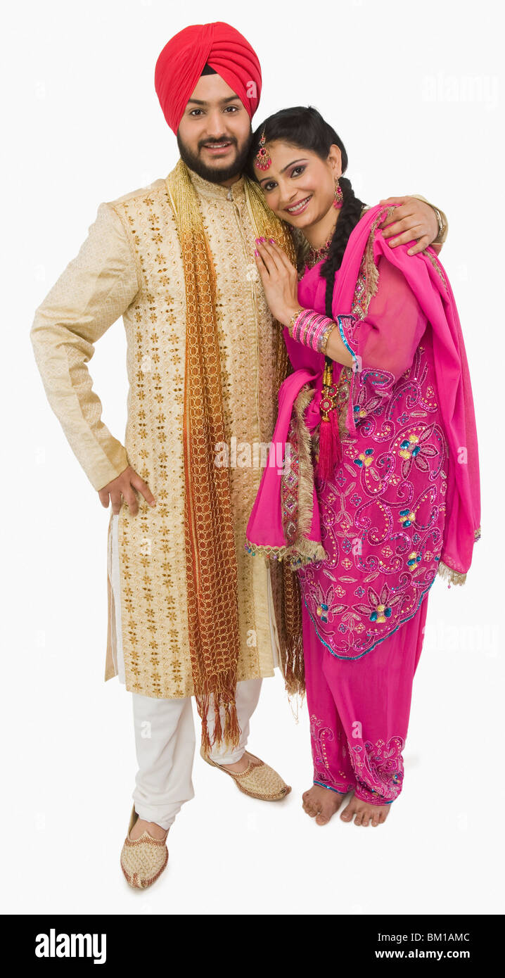Traditional dress top of punjabi couple