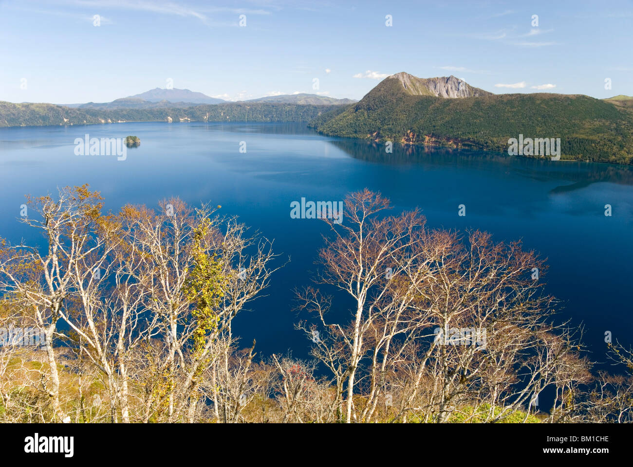 Mashu Lake lying in a volcanic caldera with a later volcanic cone on the right, Akan National Park, Hokkaido, Japan Stock Photo