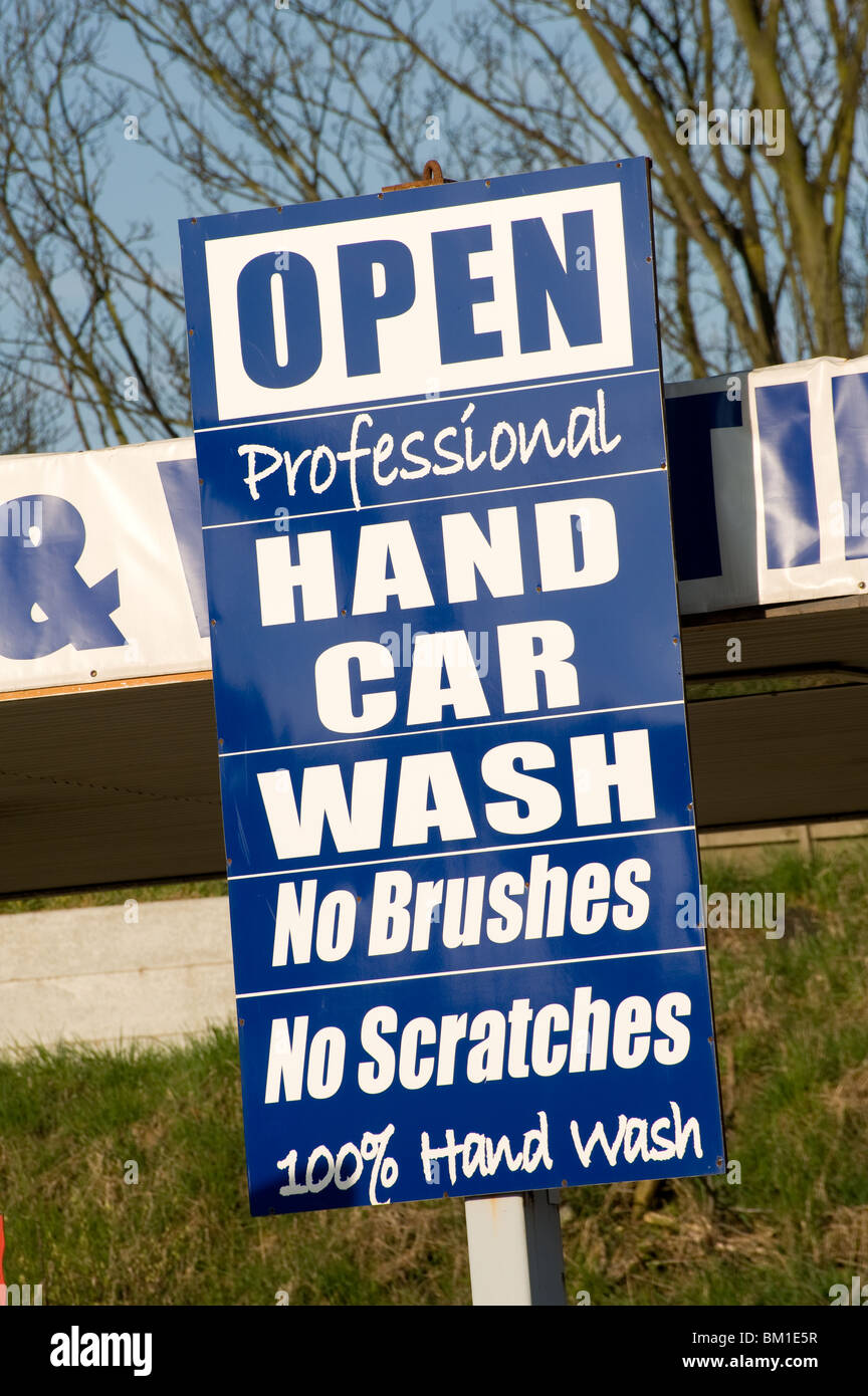 Sign advertising a hand car wash business Stock Photo - Alamy