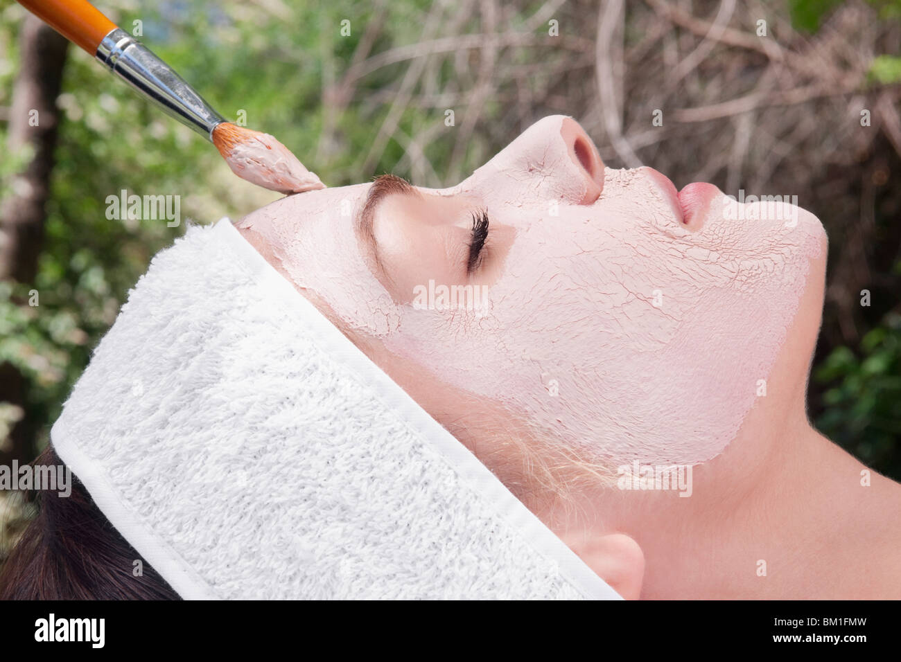 Woman applying face pack Stock Photo