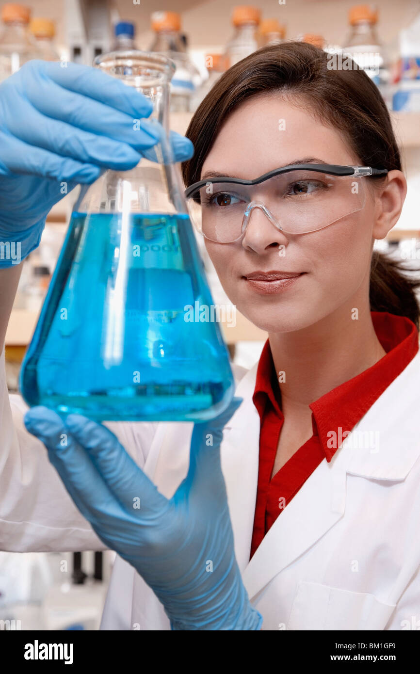 Female doctor holding a conical flask in a laboratory Stock Photo Alamy