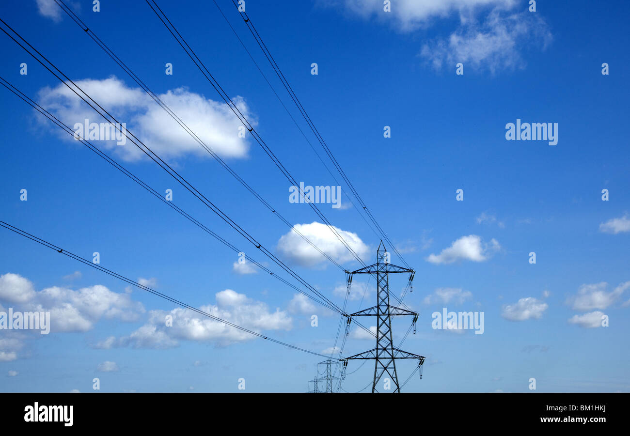 electricity pylon against blue sky Stock Photo - Alamy