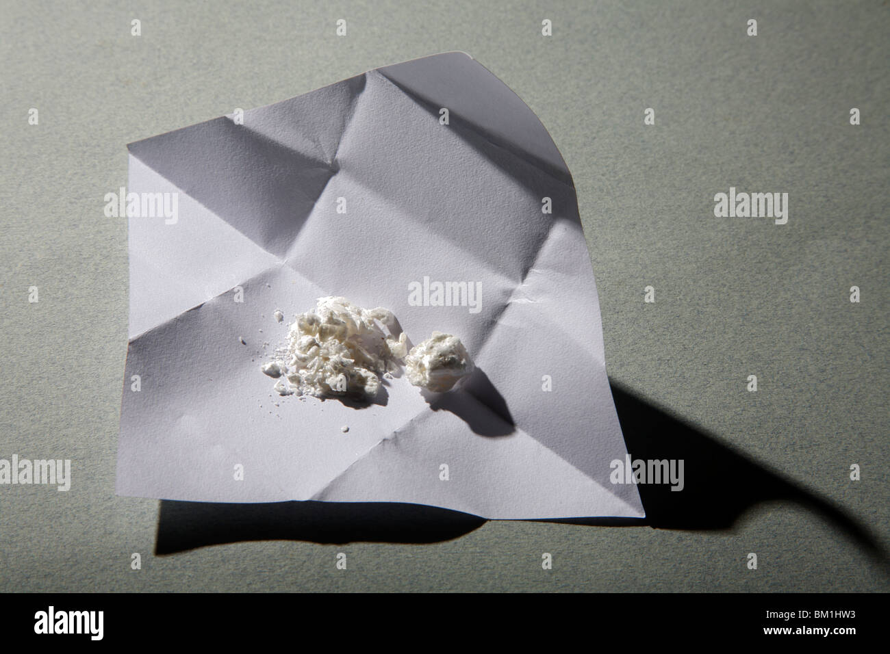 An opened one gram wrap of cocaine. Stock Photo