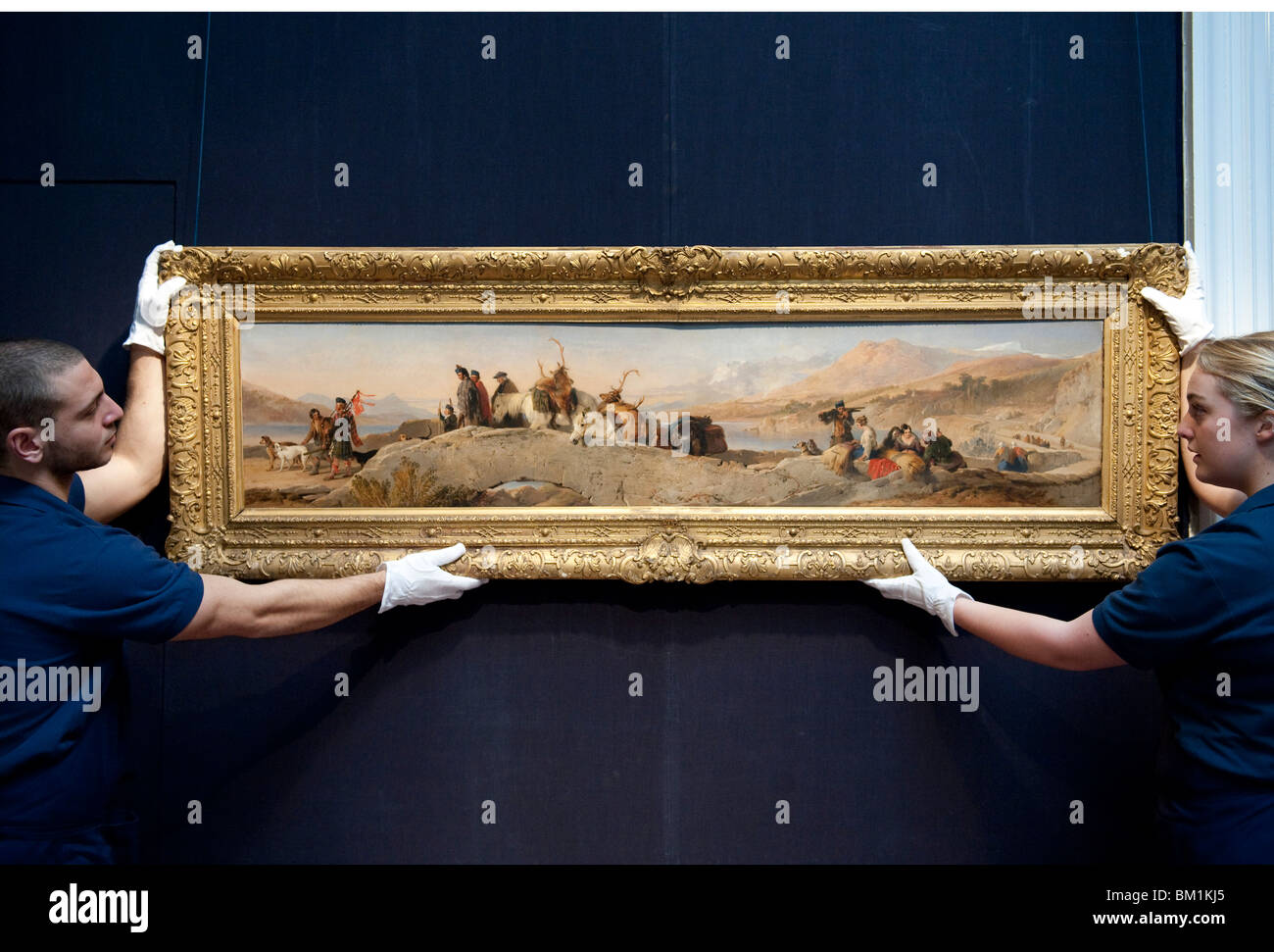 Sotheby's employees in front of a Sir Edwin Henry Landseer 'Return from the Staghunt' Stock Photo