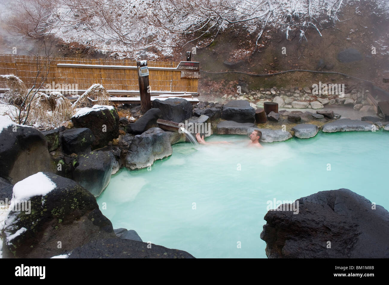 Western man bathing in Zao hot spring resort in winter, Yamagata prefecture, Japan, Asia Stock Photo