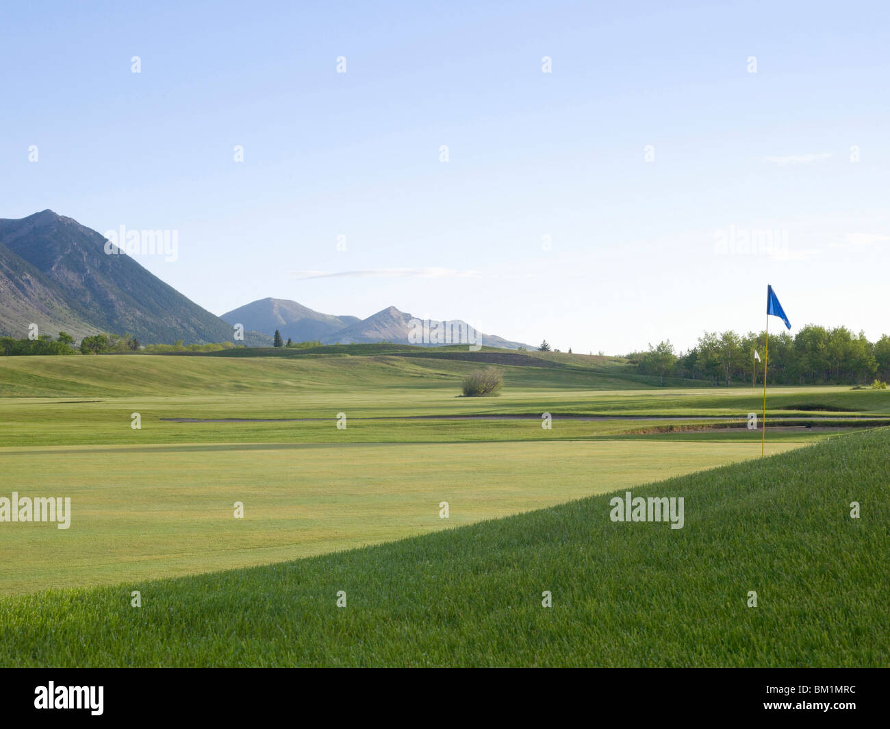 Overview of scenic Wateron Lakes Golf Course nestled at base of Rocky