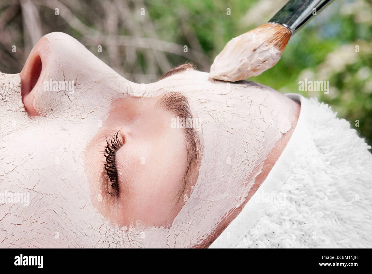 Woman applying face pack Stock Photo