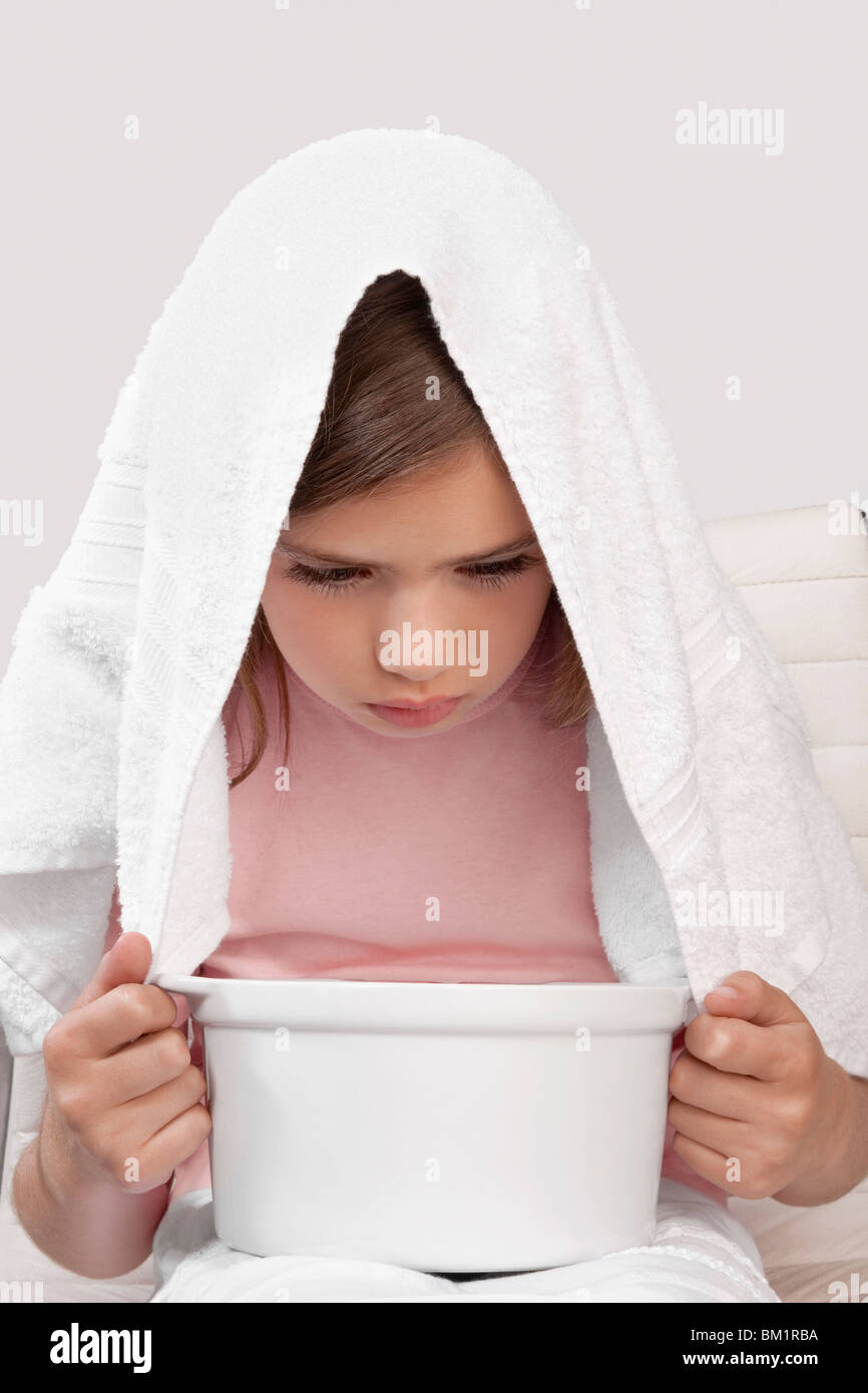 Girl inhaling steam Stock Photo Alamy