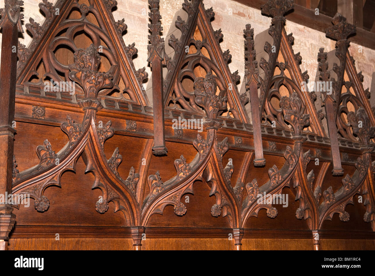 UK, England, Herefordshire, Putley church, ornately carved wooden choir stalls in gothic revival style Stock Photo