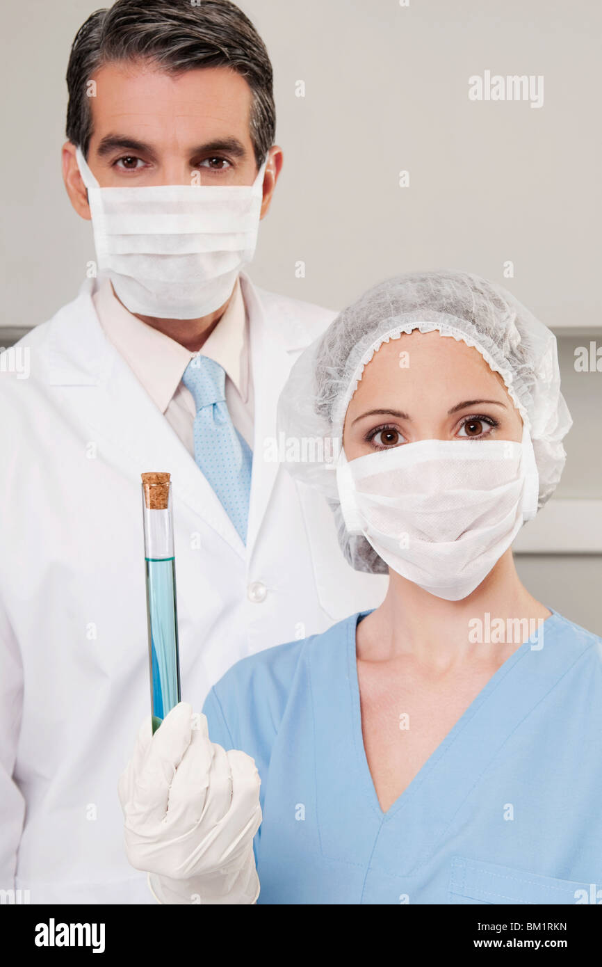 Lab technicians analyzing a sample in a test tube Stock Photo Alamy