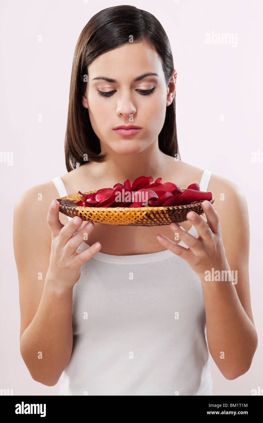 Woman smelling rose petals Stock Photo Alamy