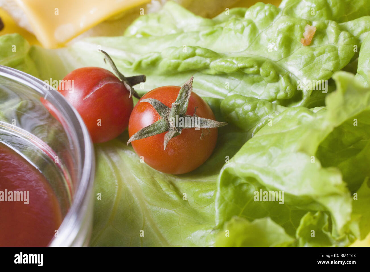 Close-up of cherry tomatoes on lettuce Stock Photo