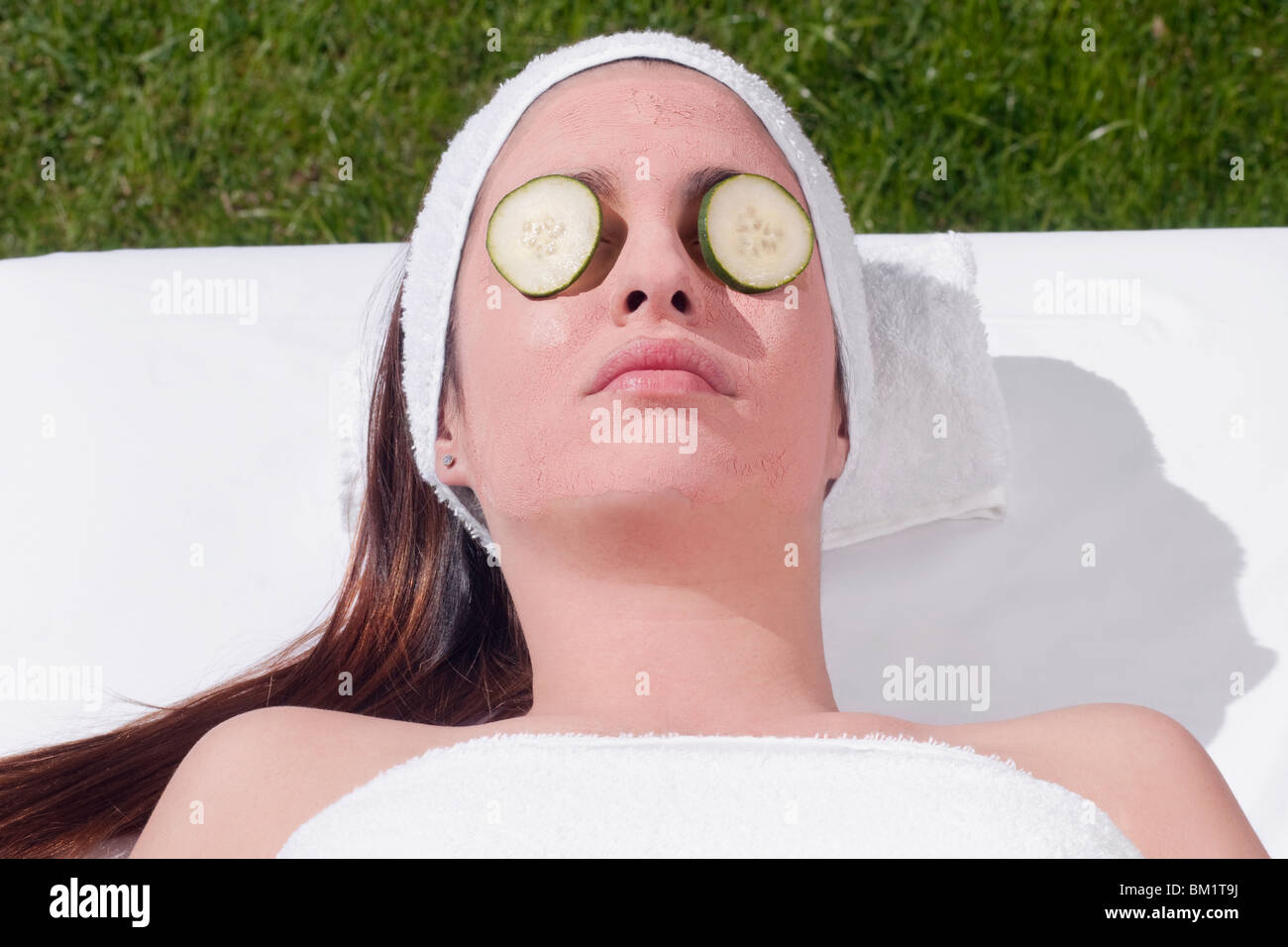 Cucumber slices on a woman's eyes Stock Photo Alamy